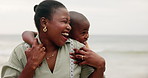 Son, child and mother with hug on beach for bonding, playing and laughing with security and comfort by sea. Black family, mom and kid by ocean with love, care and embrace on holiday, vacation or trip