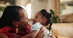 Running, love and grandmother hug girl on a sofa with hello, reunion or bonding in their home together. Black family, support and senior woman in a living room with excited kid, embrace or greeting