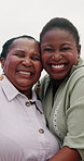 Happy, mother and daughter hug at beach with love and happiness on holiday or vacation together. African, family and portrait of mature mom in embrace with woman at ocean with kindness and support