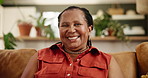 Face, happy and black woman in home living room to relax on couch in apartment alone in Kenya. Portrait, lounge and smile of African female person, positive and cheerful mature lady in causal clothes