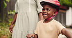 Mother, bicycle and excited child for outdoor learning, support and helping in neighborhood with holiday and fun. African family, parent and happy boy or kid with bike and safety helmet for cycling