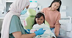 Child, pediatric dentist or education of brushing teeth in surgery or family friendly demonstration of tooth hygiene. Girl, parent or orthodontist with dental model to brush or lesson on mouth care