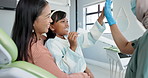 Child, pediatric dentist and high five in checkup, trust and good job for oral hygiene or healthy teeth. Girl, parent and support in consultation by orthodontist and congratulations for clean mouth