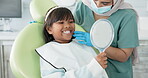 Dentist, woman and child with mirror for dental health, results and teeth cleaning service with medical advice or support. Orthodontist or doctor talking to kid or girl of tooth, procedure and mouth