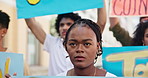 Outdoor, black woman and group with protest, shouting and voice with social justice for peace and screaming. People, community and activist with posters and banners with human rights march to end war