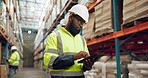 Manufacturing, warehouse and black man with tablet for inspection, inventory and online stock. Shipping, distribution and person on digital tech for logistics, maintenance and checklist in factory