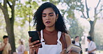 Woman, phone and angry for cyber, bullying and social media as gossip, fake news and internet fight. Unhappy, female student or smartphone to check messages as upset by read notification report