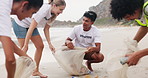 Happy group, volunteer and cleaning beach with recycling plastic, bottles and bags for community service. Volunteering workers or people collecting rubbish, dirt or garbage to save the earth or ocean