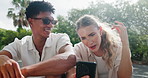 Friend, surprised or laughing at phone outdoor for social media gossip, internet meme or funny video memory. Man, woman or smartphone at park with comic blog or shocked at online dating app in nature