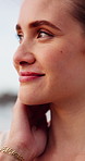 Smile, thinking and closeup of woman by beach for travel, vacation or holiday in summer. Reflection, happy and young female person with memory face expression by ocean on weekend trip in Australia.