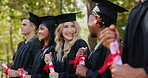 University, happy students and certificate at graduation at ceremony at campus park event. Friends, achievement or group of people smile at college celebration with diploma, opportunity and success.