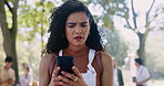 University, smartphone and angry student at campus for online bullying, gossip or bad news. College, backpack and frustrated woman with technology for stress, media post or serious conversation