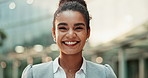 Smile, face and business woman in city with positive, good and confident attitude for career. Happy, pride and closeup portrait of professional female person from Colombia standing in urban town.