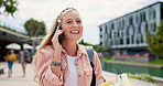 Woman, university student and laugh with phone call on walk with conversation, books and studying at campus. Girl, gen z person and happy with smartphone for funny chat on mobile network at college