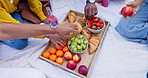 Food, hands and picnic friends or relax bonding on summer holiday or fruit meal with pastry snacks, croissant or bagel. People, fingers and eating strawberry on blanket together, park or charcuterie