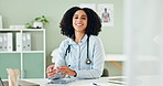 Black woman, face and technology on desk for doctor appointments or online schedule, patient charts and medical apps. Female healthcare specialist, happy and digital health records with tablet.