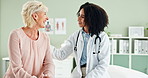 Happy woman, doctor and consulting patient with care for support, health advice or visit at the clinic. Female person, cardiologist or medical worker talking to client for consultation or trust