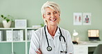 Smile, crossed arms and face of senior doctor in office at hospital with pride and confidence. Happy, professional and portrait of woman healthcare worker with positive attitude in medical clinic.