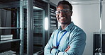 Confident, man and face for technology as computer engineer and arms crossed as specialist in data centre. Developer, happy and portrait in server room and it infrastructure for network programming