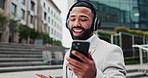 Man, headphone and dance to relax, motivation and happy work break outside office building. Good mood, male corporate worker and phone for fun, music and radio as stress relief in mental health