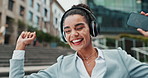 Businesswoman, headphones and city dancing with cellphone for music playlist, streaming or commute. Female person, happy and smartphone or downtown building in Canada with internet, audio or sound