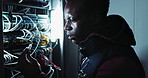 Power, electrician and black man with networking in server room, update and engineering. Professional, employee and African male person as technician for connection to cables for maintenance