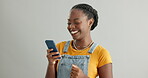 Woman, phone and laughing for meme in studio, happy and funny humor on gray background. Black female person, social media and app for online conversation, contact and comedy on tech and communication