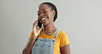 Woman, phone call and laughing on communication in studio, happy and humor on gray background. Black female person, funny and app for online conversation, contact and hello for talking on technology