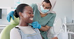 Happy woman, dentist and patient with mirror for dental care, teeth cleaning or treatment at clinic. Young female person, orthodontist and customer with big smile for oral, gum or tooth whitening