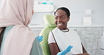 Happy woman, dentist and consulting with patient for dental care, teeth cleaning or treatment at the clinic. Young female person or orthodontist consulting customer for oral, gum or tooth whitening