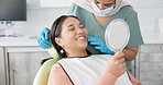 Dentist, woman patient and mirror for dental care results, teeth and smile at consultation. Medical, healthcare and orthodontist in clinic, oral hygiene examination and happy female person at checkup