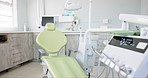 Empty dentist room, chair and equipment for cleaning, wellness and oral health with tools in clinic. Hospital, dental and mouth care by furniture, machine or interior for teeth, surgery or consulting