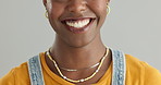 Black woman, face and teeth for dental and health in studio, happy with smile and oral hygiene on grey background. Mouth, orthodontics and positive model for fresh breathe, veneers and whitening
