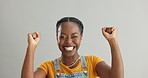 Face, excited and black woman with celebration, achievement and reaction on grey studio background. Portrait, person and model with victory or success with lottery and winner with expression or yes