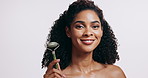 Woman, skincare and portrait with face roller in studio for massage, self care or beauty with smooth skin. Luxury, cosmetic and jade facial tool for dermatology, shine and wink on white background