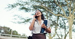 Walking, phone call and business woman in city with documents for working, career and job. Travel, morning commute and happy person on smartphone for communication, networking and talking in town
