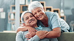 Senior couple, hug and love on sofa for marriage, support and happy life together at home. Face of elderly man and woman with embrace, bonding and romance in living room for health, care and wellness