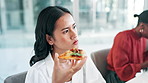 Businesswoman, pizza and eating in office for lunch with fast food or meal and hungry in workplace. Female employee, nutrition and busy listening in  business meeting with colleagues in boardroom