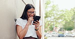 Laugh, phone and business woman in city typing message for social media, online meme and networking. Professional, travel and happy person on smartphone for internet, website and chatting in town