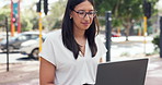 Remote work, laptop and business woman in city street for planning, research or email chat outdoor. Freelance, computer or lady consultant outside in London with social media while waiting for client
