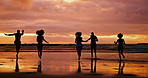 Silhouette, beach and friends running at sunset for summer vacation, holiday and travel together outdoor. Ocean, dusk and group of people at sea water for adventure, party and back view in nature