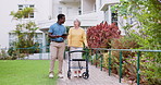 Doctor, senior woman and walking frame in garden, talking or tablet for recovery at clinic. Medic, caregiver and person with disability at hospital for care, support or touchscreen for rehabilitation