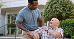 Nursing home, shoulder pain and old patient with black man, person with disability and rehabilitation. Recovery, elderly guy and pensioner with caregiver or wheelchair with help, healthcare or injury