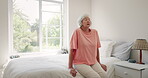 Old woman, bedroom or tired with thinking in house, retirement or mental health or anxiety on bed. Senior lady, breathing or stress relief for fatigue in nursing home, peace or mindfulness in old age