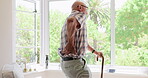 Old man, back pain or support with cane in nursing home or healthcare crisis of arthritis in living room. Elderly patient, relax or walking stick for rehabilitation or care for person with disability