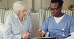 Caregiver, elderly woman or tablet in home, retirement or technology for online healthcare or support. Black man, doctor and old lady with touchscreen in consultation and checklist for help in clinic