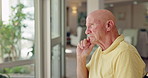 Home, wheelchair and old man with thinking, window or nostalgia with memory and depression. Person with disability, senior guy or pensioner with decision or mental health with retirement or arthritis