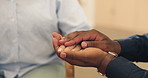 Person, care and hands together with empathy for trust, love or support in struggle, difficulty or loss at home. Closeup of people touching in embrace, concern or emotional help for understanding