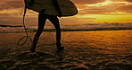 Person, silhouette and running with surfboard on beach at night for waves, sport or outdoor surfing in nature. Rear view of surfer on ocean coast in the late evening for surfing, holiday or weekend