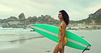 Beach, surfing in bikini and woman walking with surfboard on sand by sea or ocean for travel. Smile, summer and morning with happy young surfer person n coast for sports, training or leisure hobby